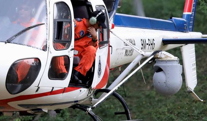 A helicopter from the Malaysian Police Air Wing Unit, equipped with a surveillance thermal imaging camera, participates in a search and rescue operation for 15-year-old Irish girl Nora Anne Quoirin who went missing from a resort in Seremban.